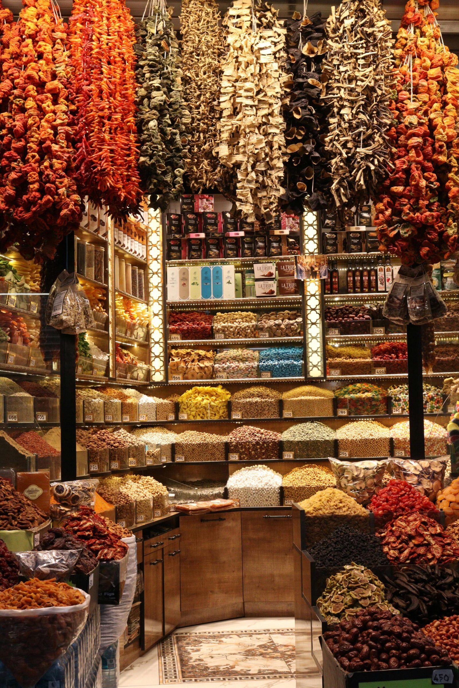 Explore a colorful assortment of spices and dried goods in a bustling Kayseri market.